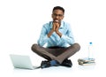 Happy african american college student with laptop, books and bo Royalty Free Stock Photo