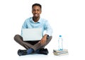 Happy african american college student with laptop, books and bo Royalty Free Stock Photo