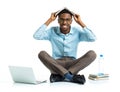 Happy african american college student sitting with laptop and b Royalty Free Stock Photo