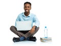 Happy african american college student sitting with laptop on wh Royalty Free Stock Photo