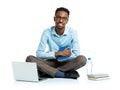 Happy african american college student sitting with laptop on wh Royalty Free Stock Photo