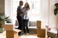 Happy African American couple dancing after moving