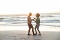 Happy african american couple dancing and smiling on sunny beach, copy space Royalty Free Stock Photo