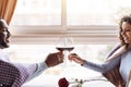 Happy African American couple drinking wine in the restaurant Royalty Free Stock Photo