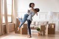 Happy african couple first time home buyers celebrate moving day Royalty Free Stock Photo