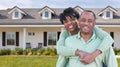 Happy African American Couple In Front of Beautiful House. Royalty Free Stock Photo