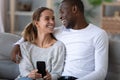 Happy African American couple having fun with phone at home Royalty Free Stock Photo