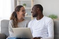 Happy African American couple having fun, using laptop Royalty Free Stock Photo