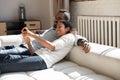 Happy African American couple in love using app on smartphone