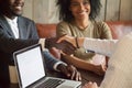 Happy african american couple making deal handshaking caucasian Royalty Free Stock Photo