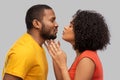 Happy african american couple reaching for kiss