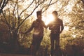 Happy African American couple running and catching in park Royalty Free Stock Photo