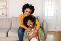 Happy African American Couple Sharing Warm Embrace on Sofa Indoor Royalty Free Stock Photo