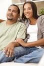 Happy African American Couple Sitting At Home Royalty Free Stock Photo