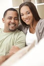Happy African American Couple Sitting At Home Royalty Free Stock Photo