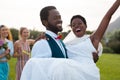 Happy african american couple smiling and carrying during wedding Royalty Free Stock Photo