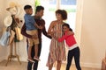 Happy african american couple with son and daughter embracing and smiling at home Royalty Free Stock Photo