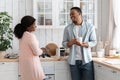 Happy african american couple talking in cozy kitchen, enjoying spending time together Royalty Free Stock Photo