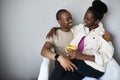 Happy african american couple talking and drinking tea Royalty Free Stock Photo