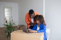 Happy African American Couple Using Laptop After Moving In New House Royalty Free Stock Photo