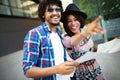Happy black couple on vacation sightseeing city with map Royalty Free Stock Photo