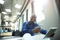 Happy african american entrepreneur using tablet computer. Royalty Free Stock Photo