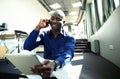 Happy african american entrepreneur using tablet computer. Royalty Free Stock Photo