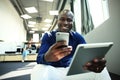 Happy african american entrepreneur using tablet computer. Royalty Free Stock Photo