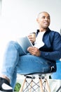 Happy african american entrepreneur using tablet computer. Royalty Free Stock Photo