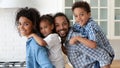 Happy African American family couple holding little sibling kids Royalty Free Stock Photo