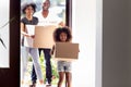 Happy African American family with daughter entering in new house Royalty Free Stock Photo