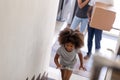 Happy African American family with daughter moving in new house Royalty Free Stock Photo