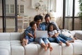 Happy African American family enjoying leisure time at laptop Royalty Free Stock Photo