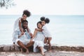 Happy African American family, Father, Mother, Two daughter enjoying and funning together in outdoor park seaside. Royalty Free Stock Photo