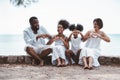 Happy African American family, Father, Mother, Two daughter enjoying and funning together in outdoor park seaside. Vacation relax Royalty Free Stock Photo