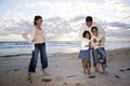 Happy African-American family of four on beach Royalty Free Stock Photo