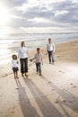 Happy African-American family of four on beach Royalty Free Stock Photo