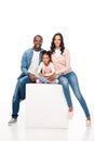 happy african american family with one child sitting together and smiling at camera Royalty Free Stock Photo