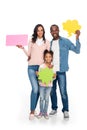happy african american family holding blank speech bubbles and smiling at camera Royalty Free Stock Photo