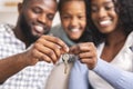 Happy african american family holding keys from their new home Royalty Free Stock Photo