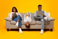 Happy African American family holding and using gadgets Royalty Free Stock Photo