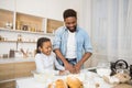 Happy african american family kneading dough together Royalty Free Stock Photo