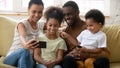 Happy african American family making selfie on smartphone together Royalty Free Stock Photo