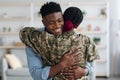 Happy black family military wife and husband embracing at home Royalty Free Stock Photo