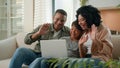 Happy African American family mom dad and teen son use laptop webcam distance video call multiracial parents little boy Royalty Free Stock Photo