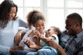 Happy African American family playing with children at home Royalty Free Stock Photo