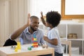 Happy african american family playing toys at home. Royalty Free Stock Photo