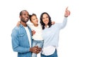 happy african american family pointing with finger and looking away