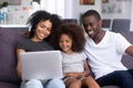 Happy African American family relax on couch with laptop Royalty Free Stock Photo