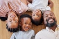 Happy african american family relaxing together and bonding at home. Little brother and sister spending time with their Royalty Free Stock Photo